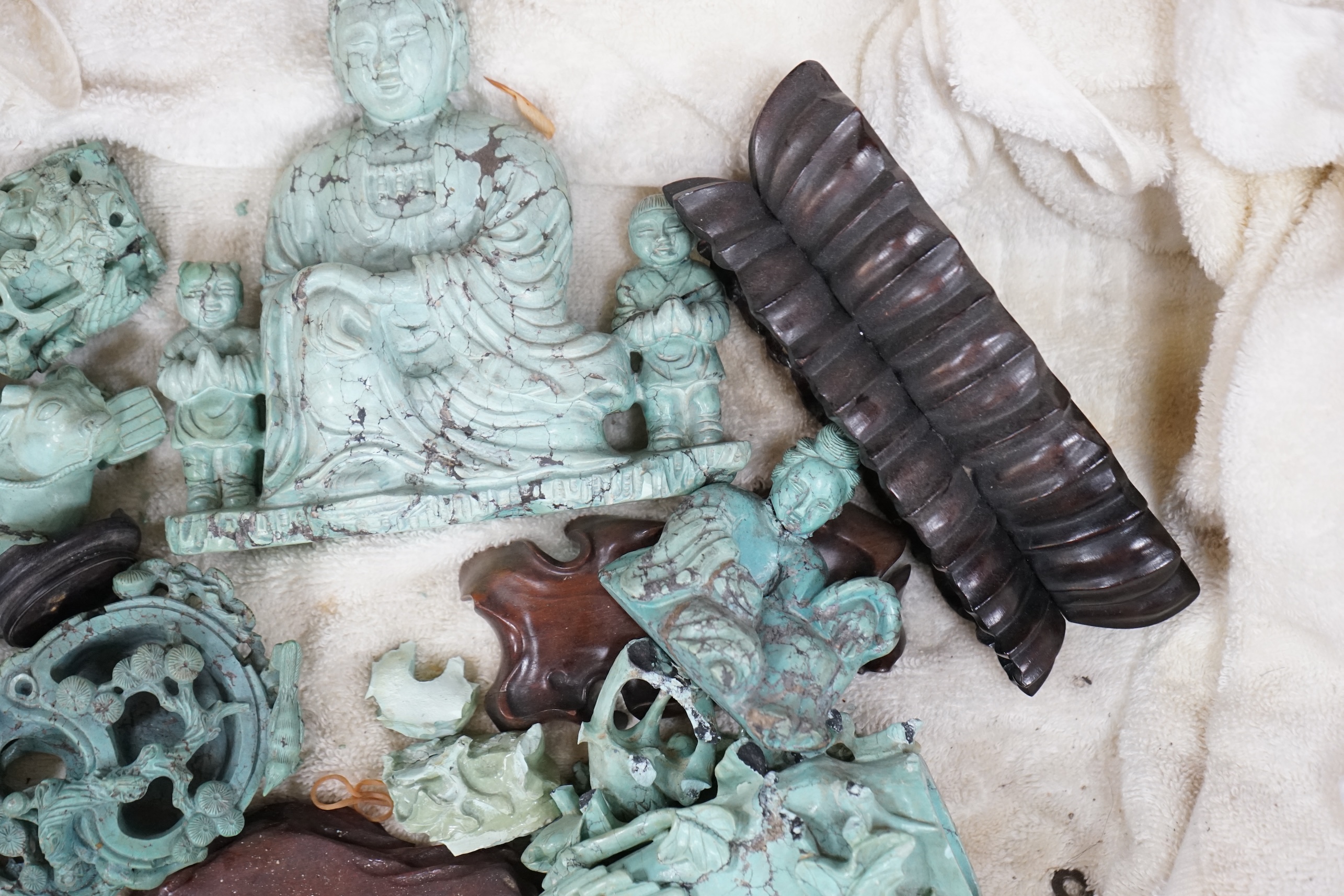 A group of Chinese turquoise matrix carvings, comprising a boy on a buffalo, 5.5in. a brushwasher, 7in. a vase and cover, 6.5in. a snuff bottle and a figure of a woman, 4.5in. (all a.f.)